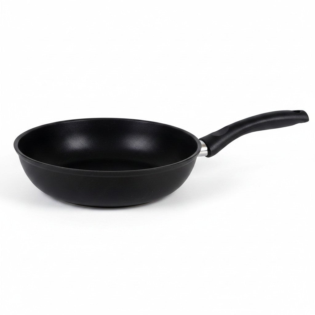 Asia Trade 22cm non-stick cast aluminum frying pan with black handle, PFOA-free and dishwasher safe.