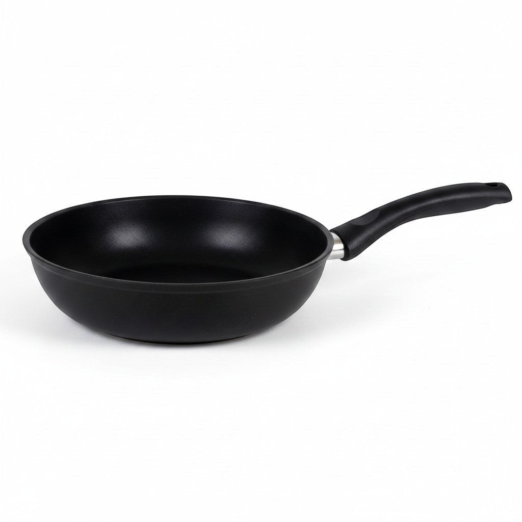 Asia Trade 24cm non-stick cast aluminum frying pan with a black ergonomic handle, ideal for healthy cooking.