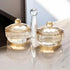Asia Trade Novell Collection amber crystal glass salt and spice shakers set with lids and a central carrying handle.