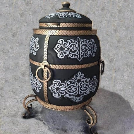 Asia Trade 100L insulated tandoor oven in black with ornate gold carvings, metal handles, and a hinged lid.
