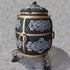 Asia Trade 100L insulated tandoor oven in black with ornate gold carvings, metal handles, and a hinged lid.