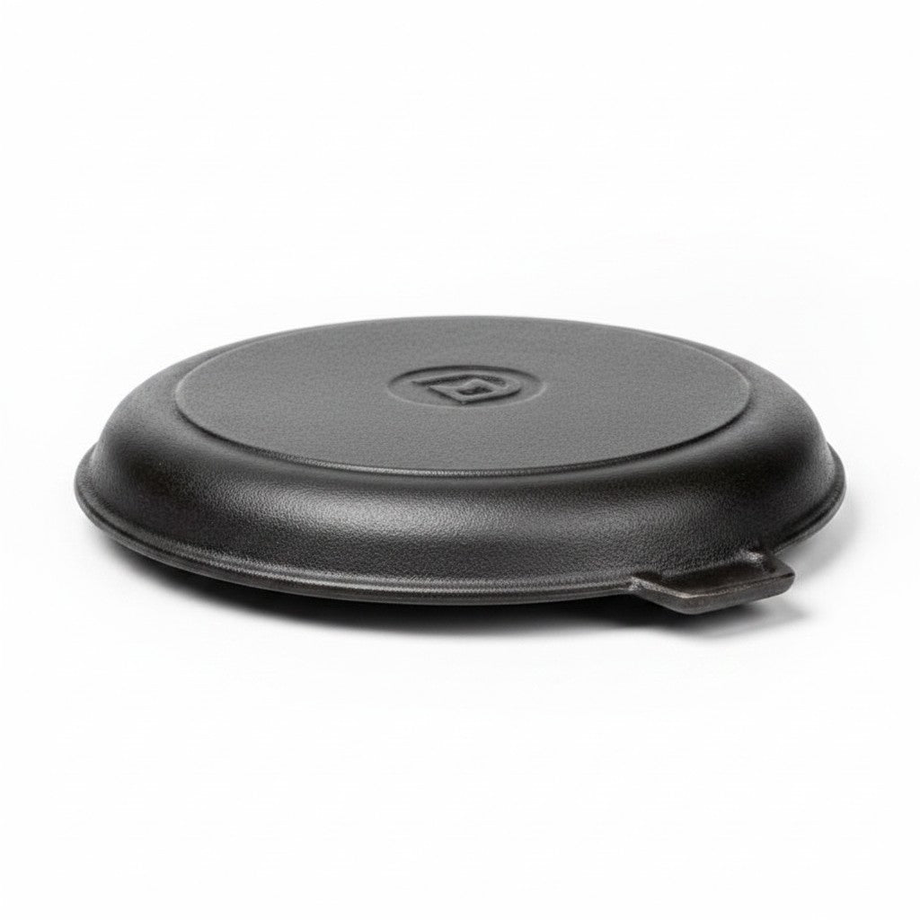 Asia Trade 28cm round cast iron skillet lid with a textured black finish and central logo detail