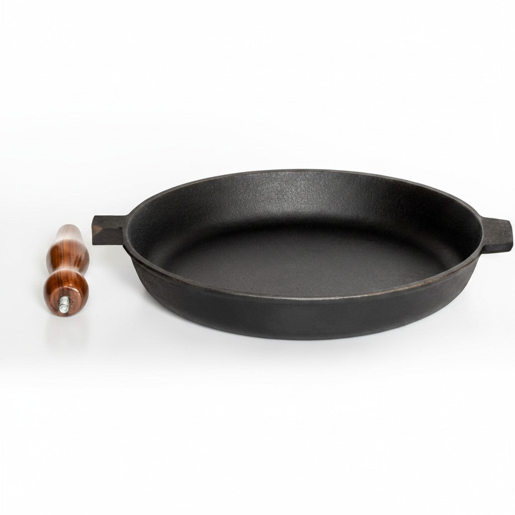 Asia Trade 28cm cast iron skillet with a detachable wooden handle, suitable for induction and open fire cooking.