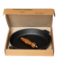 Asia Trade 28cm cast iron skillet with a detachable wooden handle, presented in its original cardboard packaging.