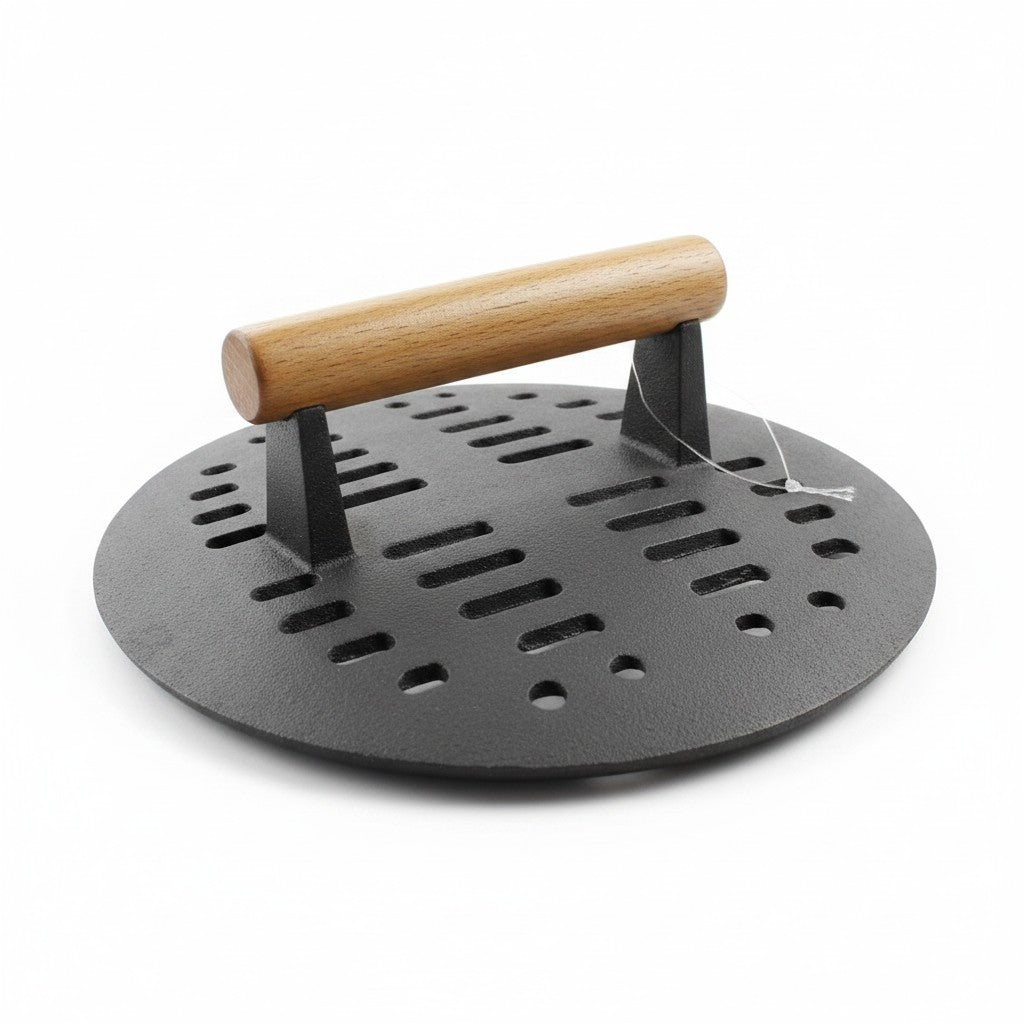 Asia Trade cast iron Tabaka grill press with a wooden handle for searing chicken and meat on a pan