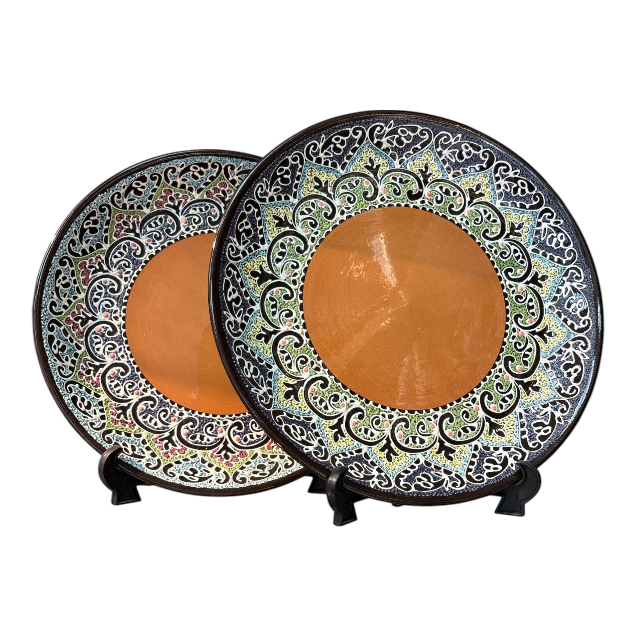 Asia Trade decorative ceramic plate with intricate black, blue, and green floral patterns and a terracotta center