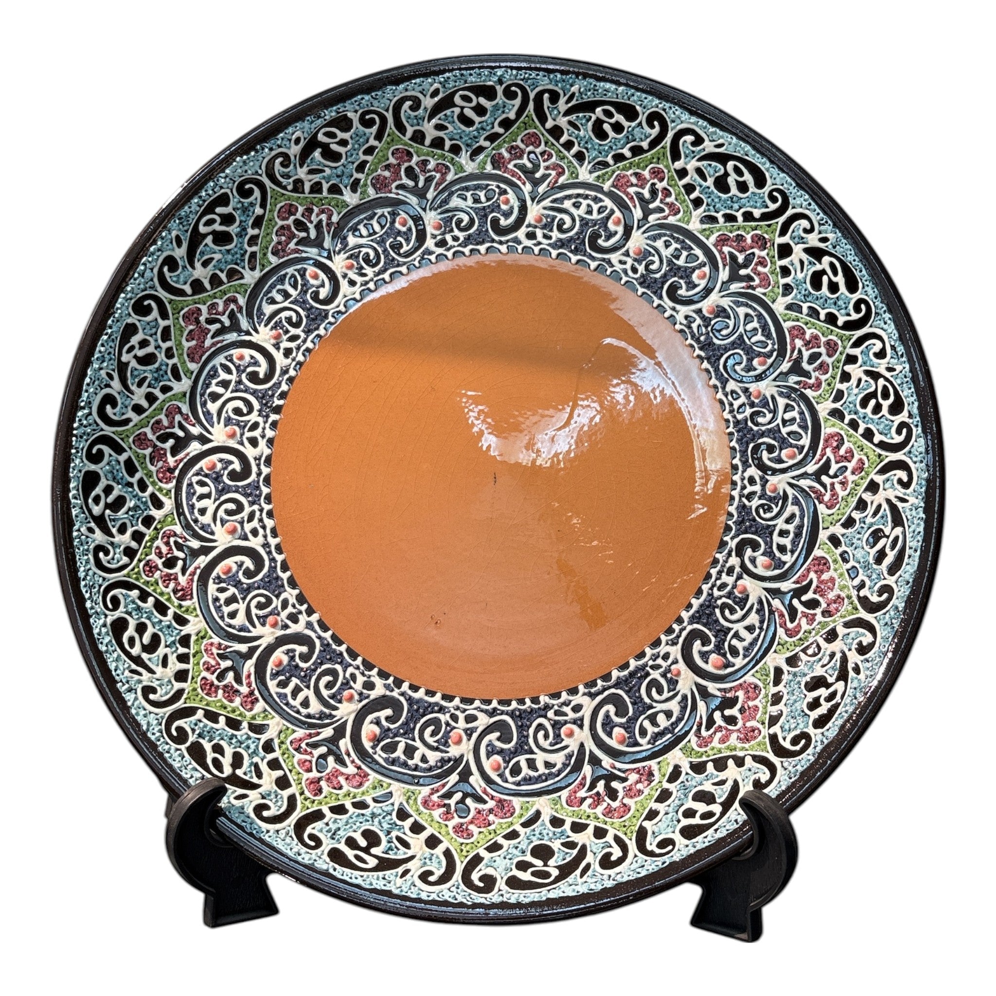 Asia Trade 32cm decorative ceramic plate with intricate floral patterns in blue, green, and red on a terracotta base.