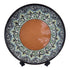 Asia Trade 32cm decorative ceramic plate featuring a solid terracotta center and intricate black, green, and white floral patterns.