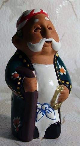 Asia Trade handcrafted clay figurine of an elderly man in traditional Uzbek attire, 11cm tall.