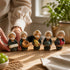 Asia Trade handcrafted Uzbek figurines featuring five elderly men in traditional attire holding various food items