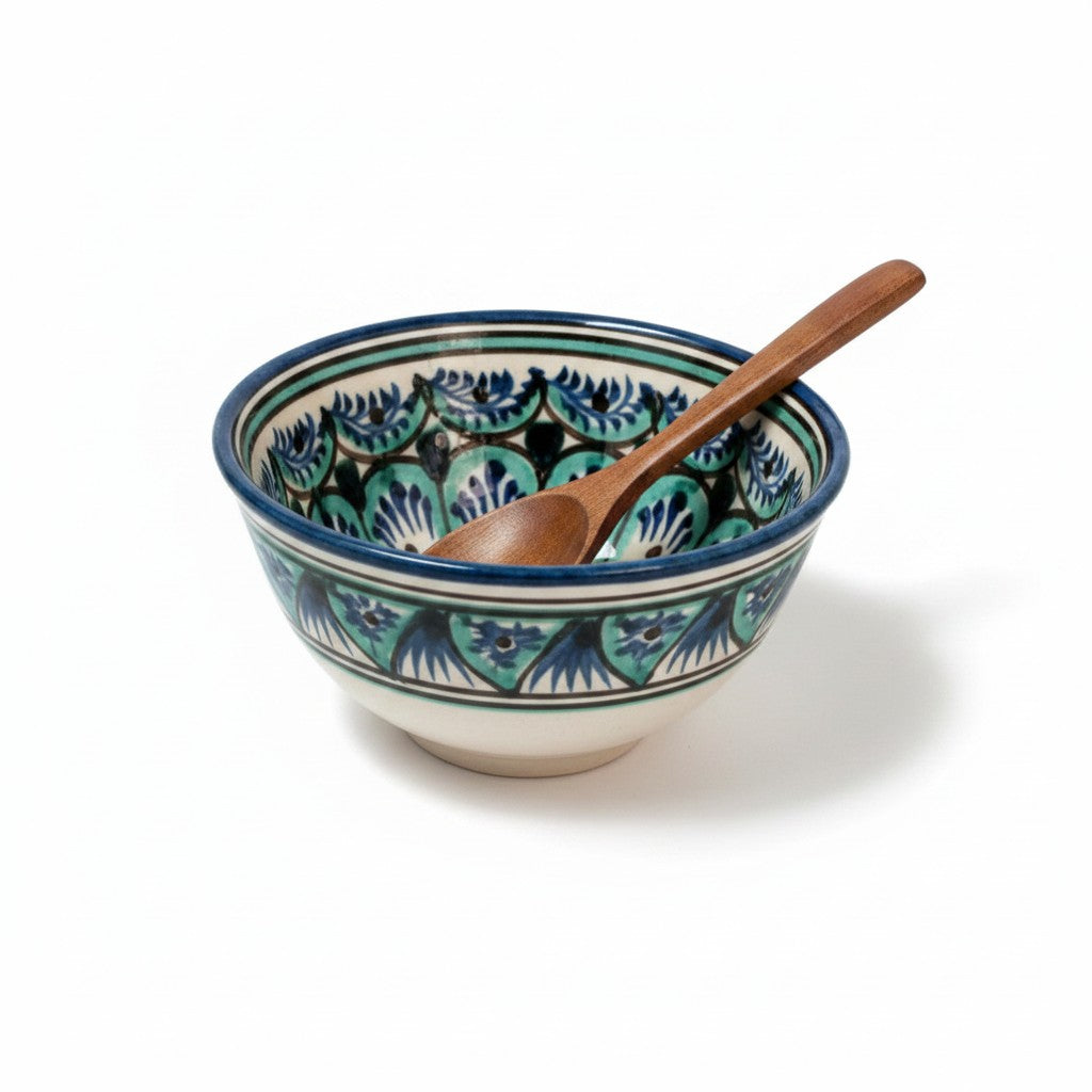 Asia Trade handmade ceramic soup bowl from Uzbekistan with blue and green floral patterns and a wooden spoon