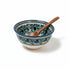 Asia Trade handmade ceramic soup bowl from Uzbekistan with blue and green floral patterns and a wooden spoon