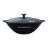 Asia Trade Kukmara 2.7L black cast iron wok with aluminum lid, suitable for induction and open fire cooking.