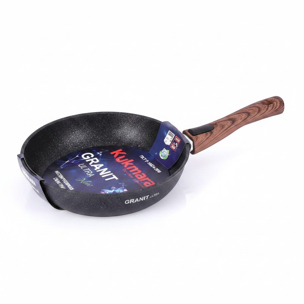 Asia Trade Kukmara 28cm cast aluminum frying pan with non-stick granite coating and a detachable wood-look handle.