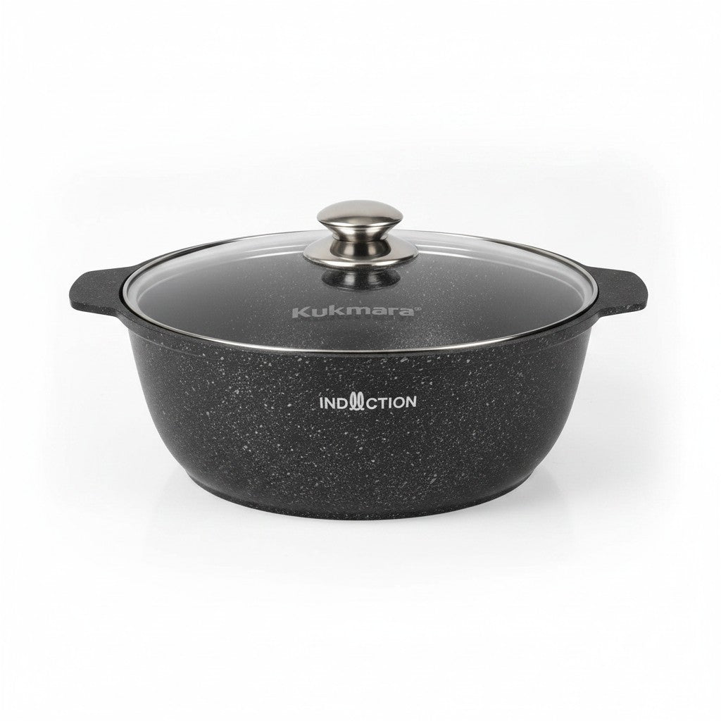 Asia Trade Kukmara 4-liter induction roaster pot in dark marble finish with a glass lid and cast aluminum body.