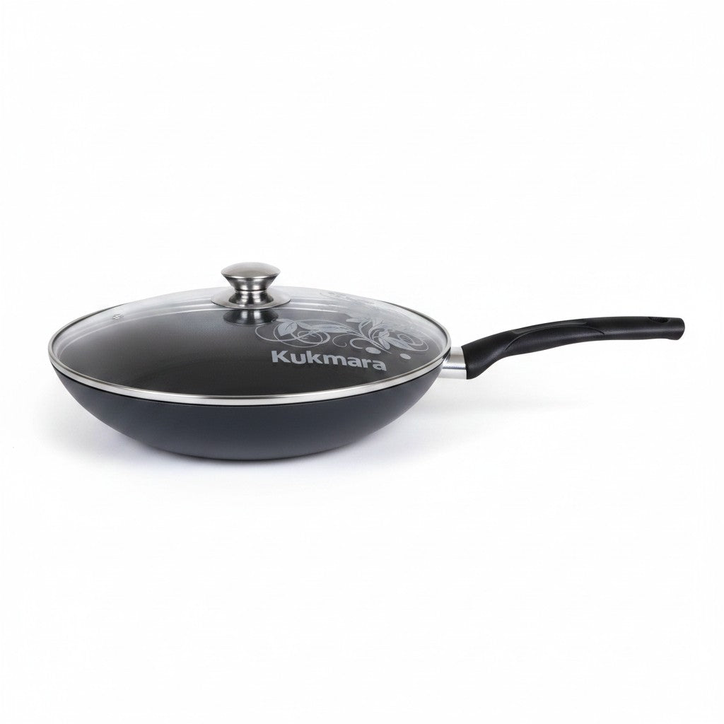 Asia Trade Kukmara 28cm non-stick wok pan with glass lid, made of durable cast aluminum for even cooking.