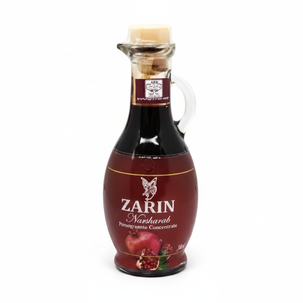 Asia Trade 100% natural pomegranate concentrate in a 350g glass bottle, ideal for salads and stews.