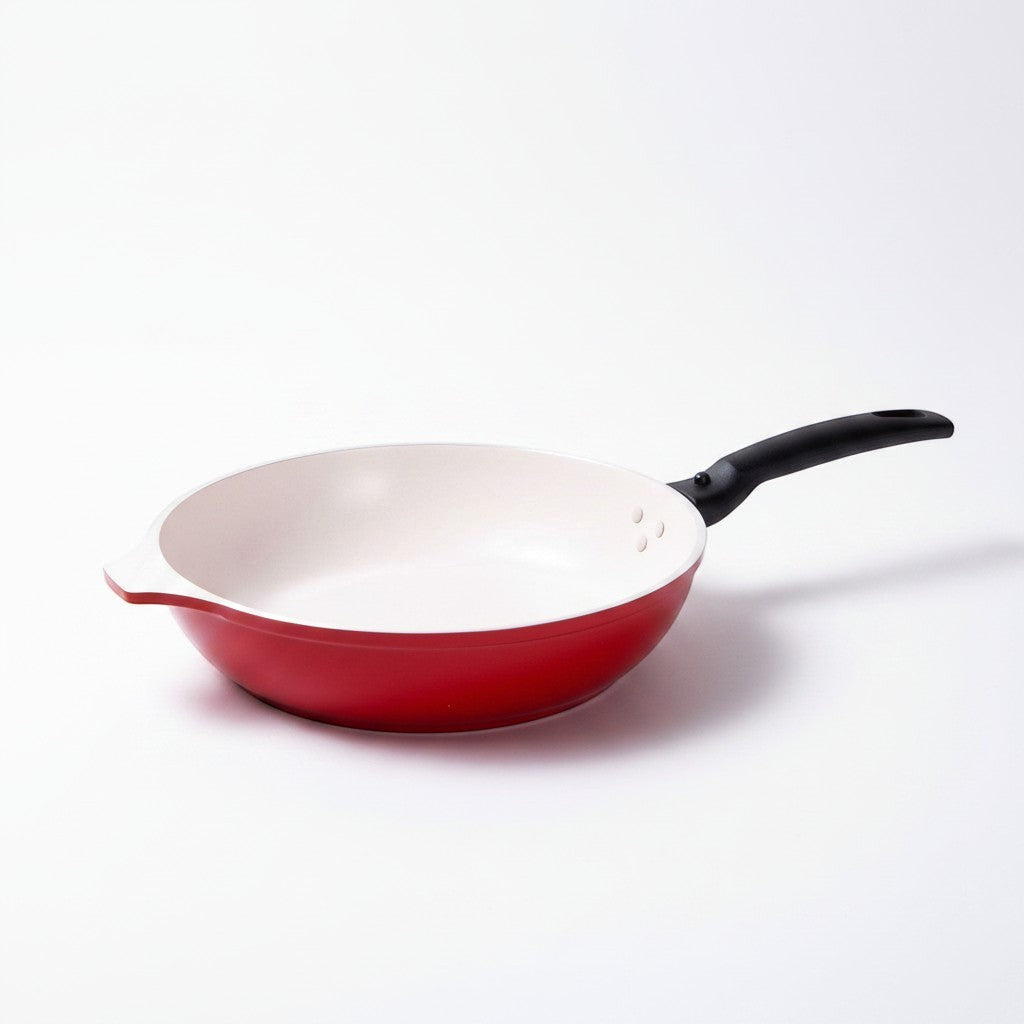 Asia Trade 28cm red cast aluminum frying pan with marble-effect non-stick coating and a detachable black handle.
