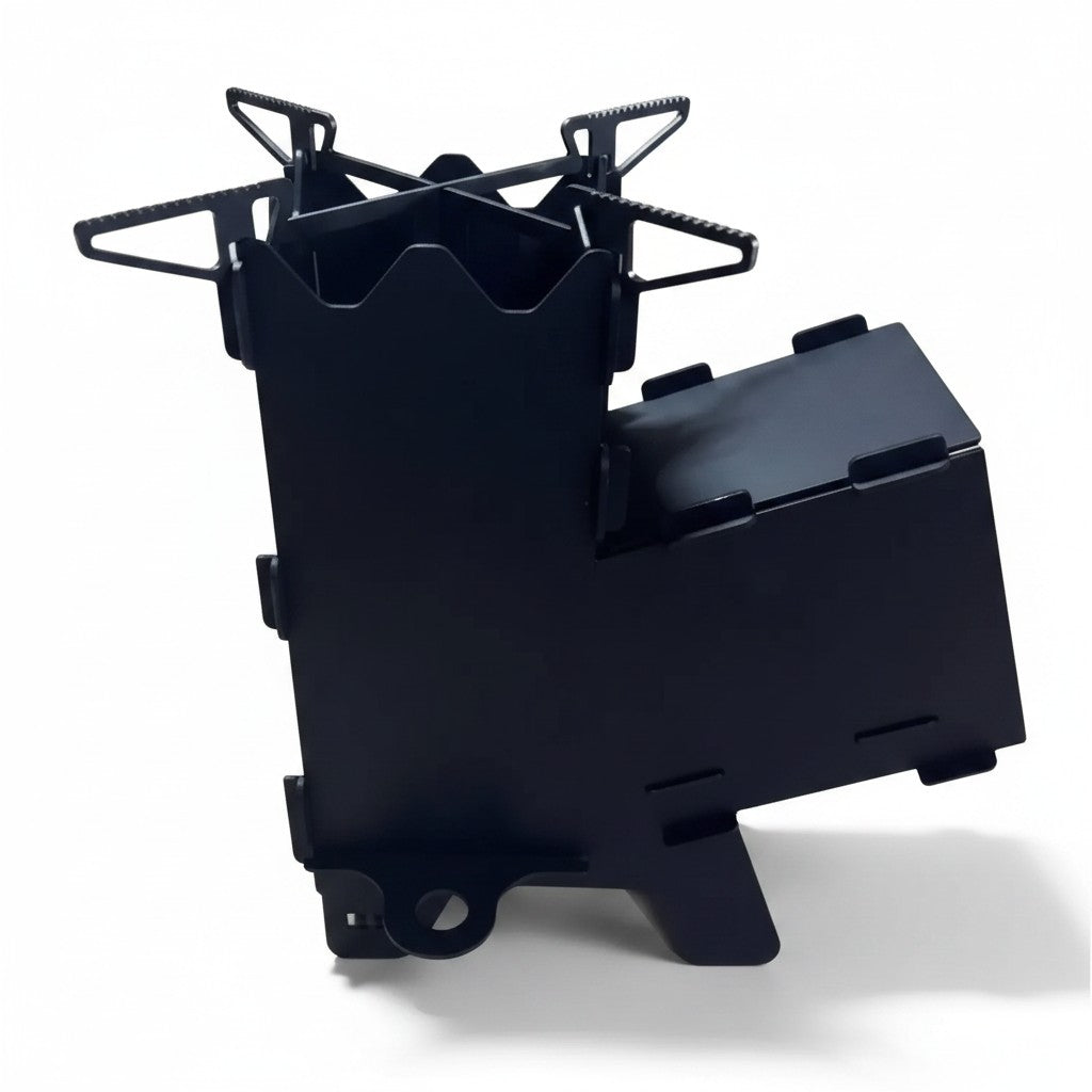 Asia Trade Rocket D2 portable steel camping stove in black with a cross-shaped pot support for outdoor cooking.