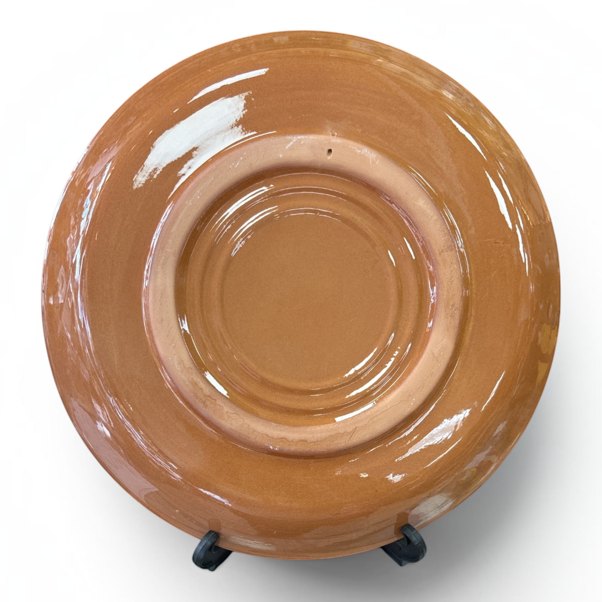 Asia Trade 32cm decorative ceramic plate in a glossy terracotta brown finish, viewed from the underside.